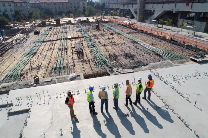 LMI Jobs seven construction workers standing on white field